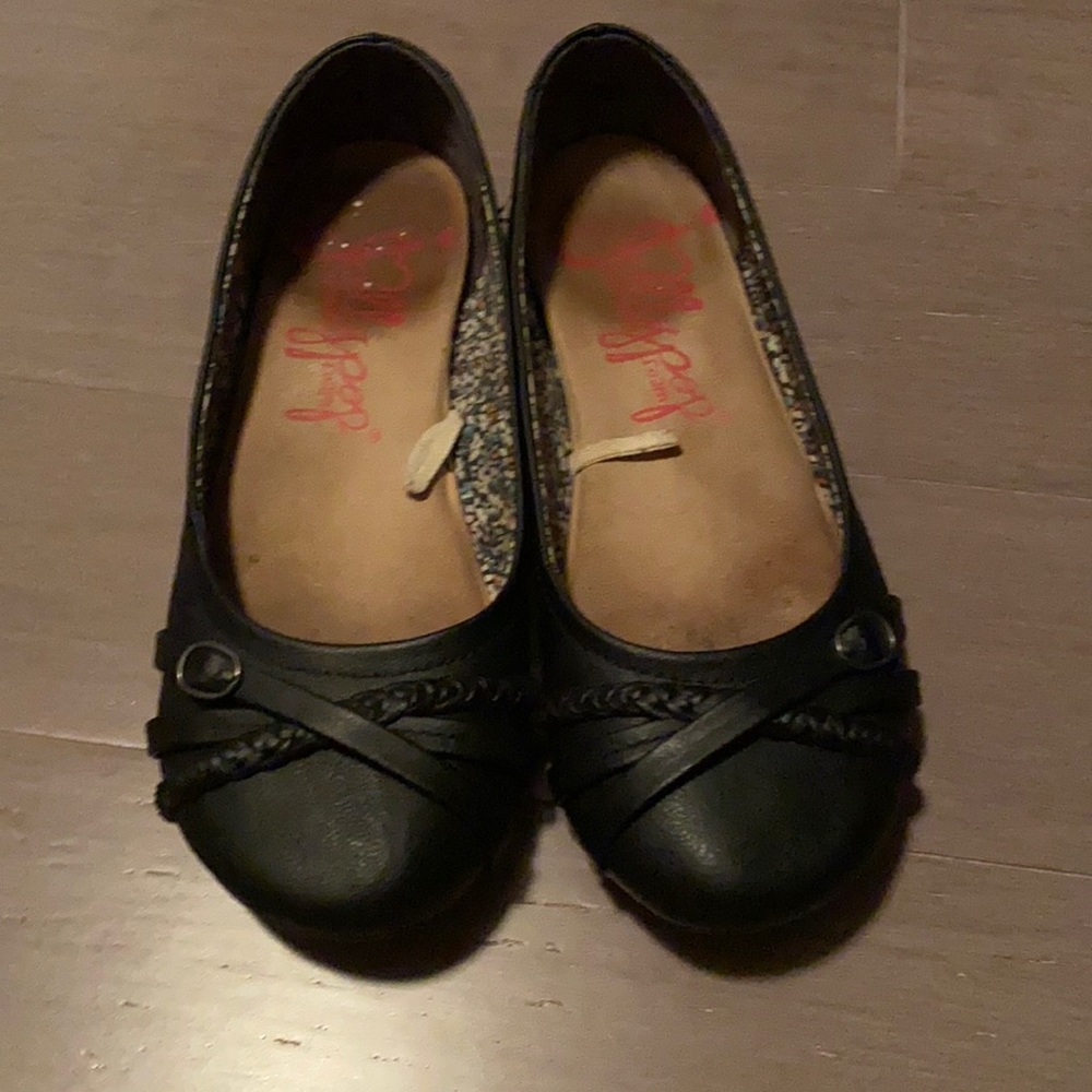 Black jelly pop flats in a size 5.5